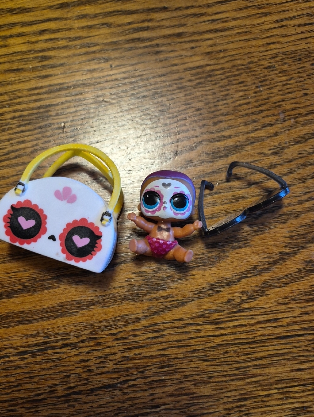 L.O.L. Surprise! Mini Doll with White & Yellow Purse and Black Sunglasses